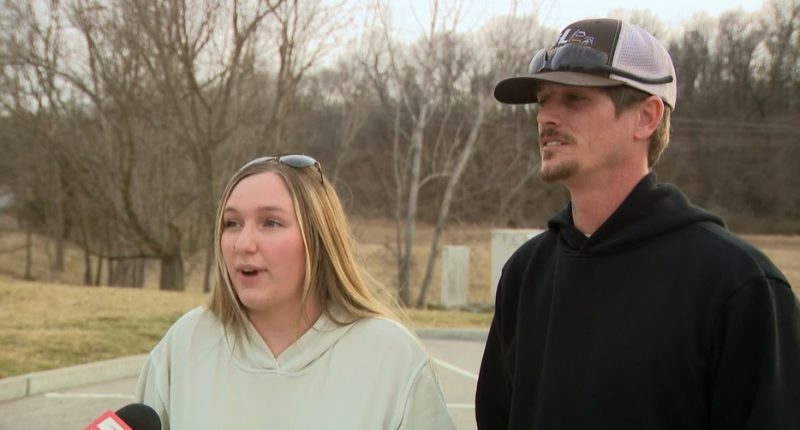 Couple being interviewed about a robbery.