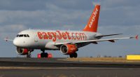 EasyJet Airbus A320-214 taxiing at Prague Airport.