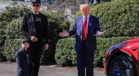 President Trump, Elon Musk, and his son X stand by a red Tesla.