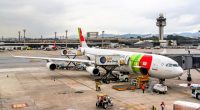 TAP Portugal Airbus A340 boarding at Guarulhos International Airport.