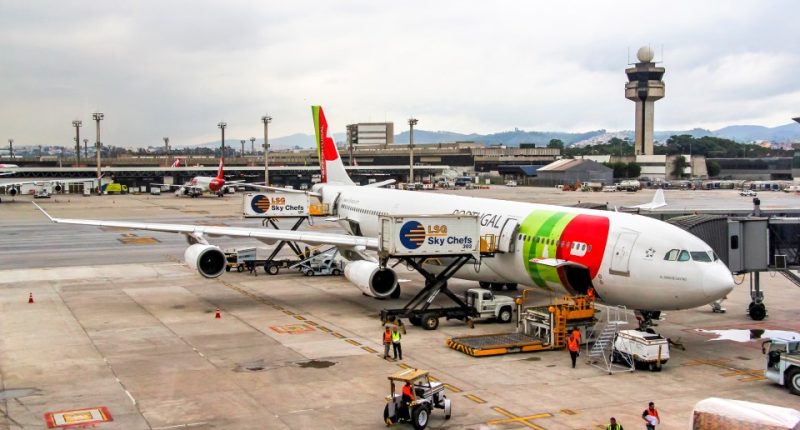 TAP Portugal Airbus A340 boarding at Guarulhos International Airport.