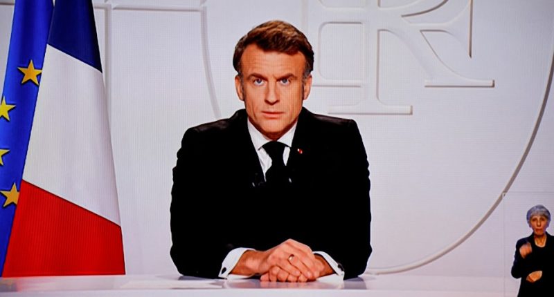 This photograph taken on March 5, 2025, shows a television screen broadcasting France's President Emmanuel Macron addressing a live interview on French TV at the Elysee Presidential Palace in Paris. Emmanuel Macron announced on March 5, 2025, that France will gather next week in Paris the chiefs of staff from countries ready to guarantee a future peace in Ukraine. (Photo by Ludovic MARIN / AFP) (Photo by LUDOVIC MARIN/AFP via Getty Images)
