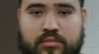 Mugshot of a man with a beard.