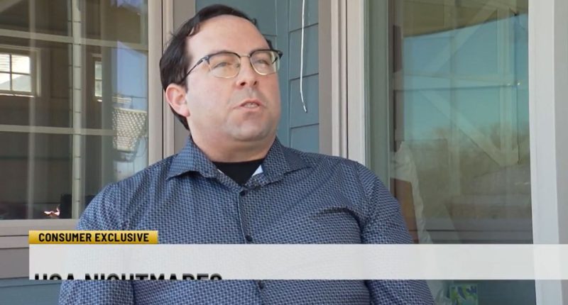 Man in glasses speaks outside his home.