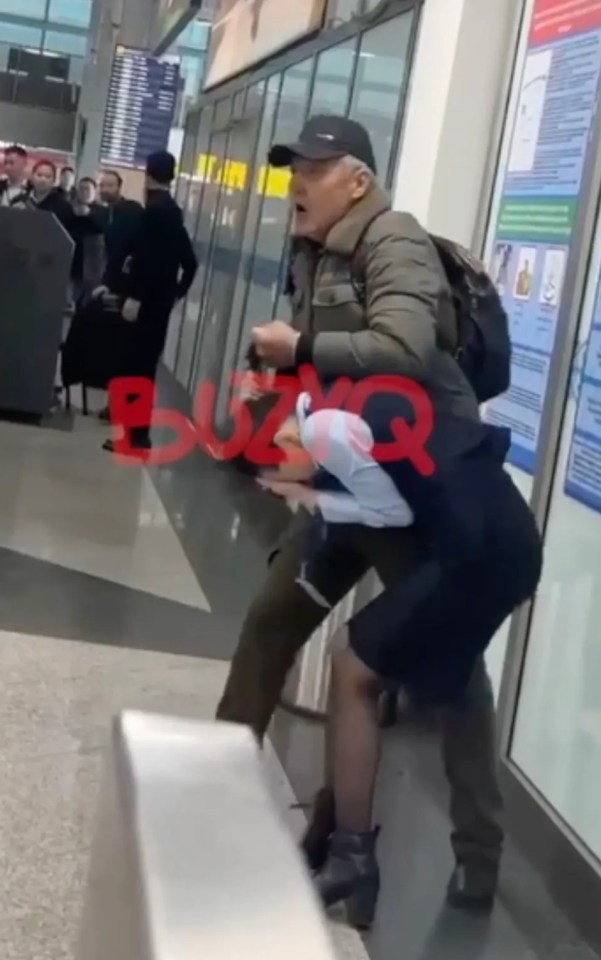 A man holding a security officer hostage at an airport.