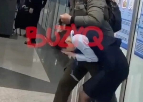 A man holding a security officer hostage at an airport.