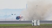 Photo of an airplane crashing at an airshow.