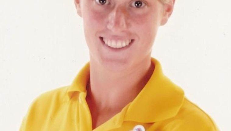 Photo of Rebecca Coriam wearing a yellow Youth Team polo shirt.