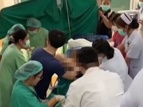 Medical personnel assisting with a hospital birth during an earthquake.