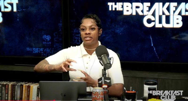 Woman speaking into a microphone on The Breakfast Club.