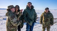 Vice President JD Vance and his wife touring a US military base in Greenland with military personnel.
