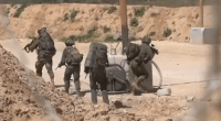 Soldiers patrolling a desert area.
