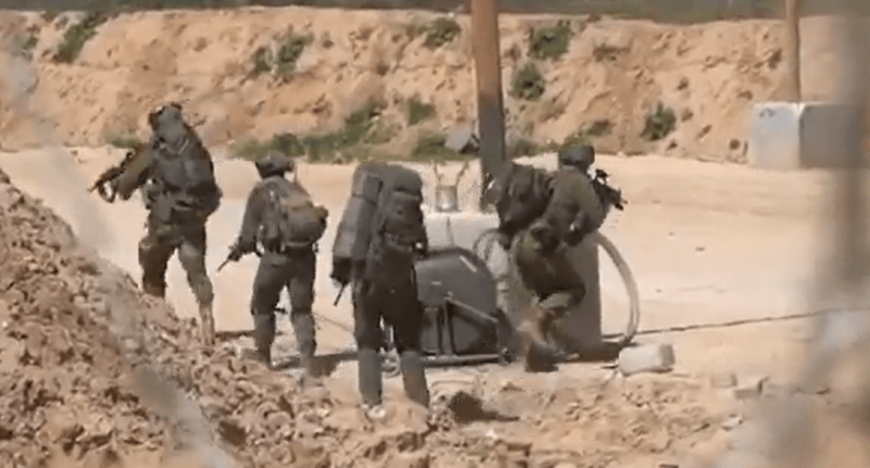 Soldiers patrolling a desert area.