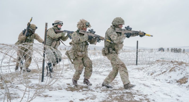 British soldiers conducting an assault during a NATO exercise in Romania.