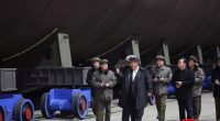 Kim Jong Un inspecting a nuclear submarine under construction.