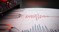 Illustration of a seismograph printing seismic activity records.