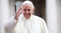 Pope Francis waving to the crowd.