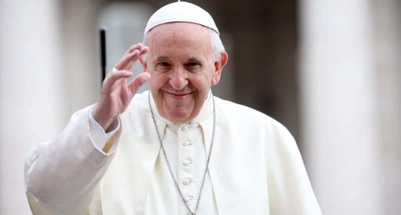 Pope Francis waving to the crowd.