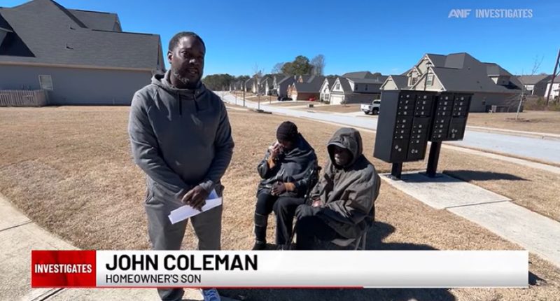 John Coleman, homeowner's son, speaks with his parents in front of their home.