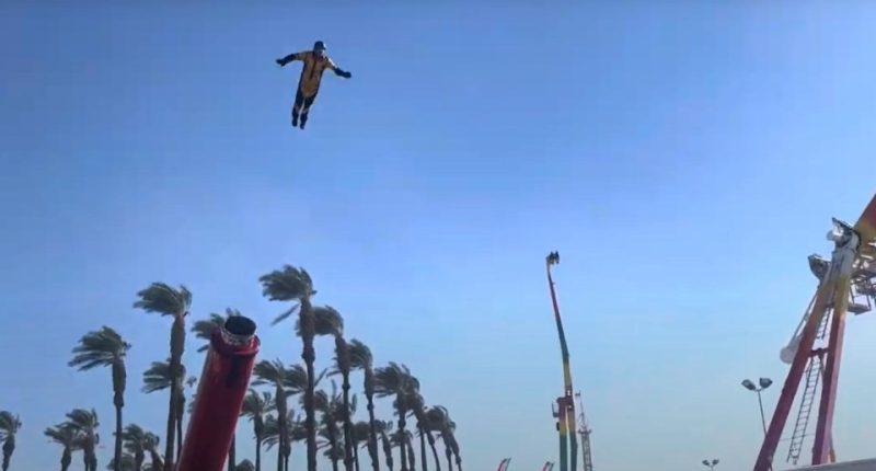 Stuntman flying through the air during a human cannonball act.