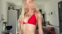 Photo of a woman in a red bikini; her face is blurred.