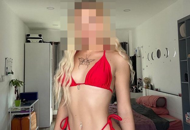 Photo of a woman in a red bikini; her face is blurred.