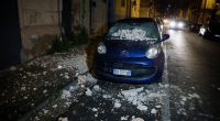 Car damaged by earthquake debris.