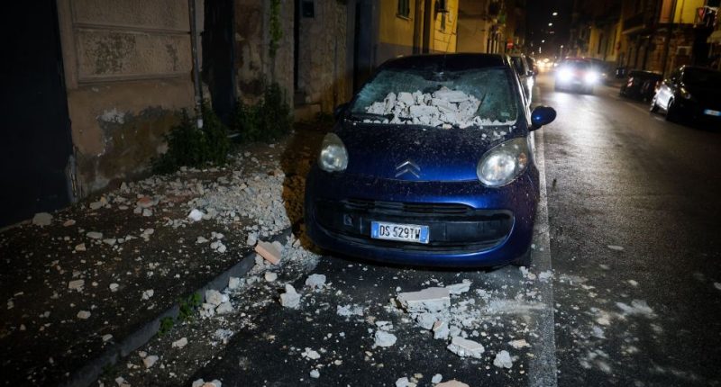 Car damaged by earthquake debris.