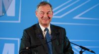 Photo of Rupert Lowe, Reform UK MP, at a podium.