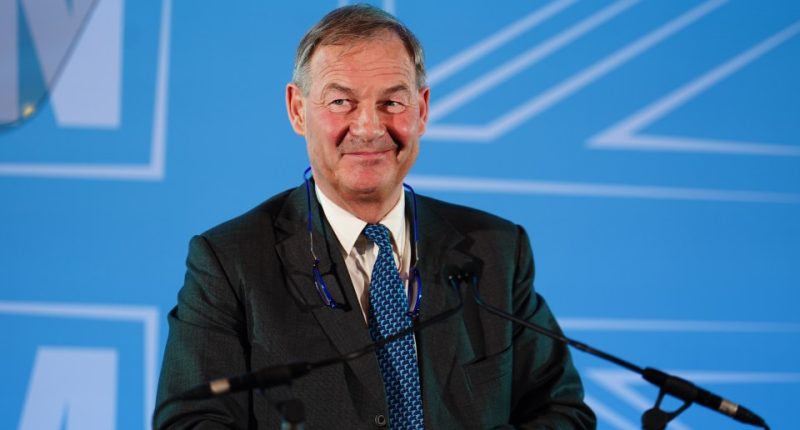 Photo of Rupert Lowe, Reform UK MP, at a podium.