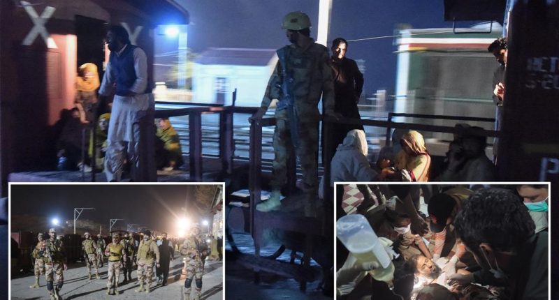Pakistani security forces battle to free about 300 hostages aboard a hijacked train