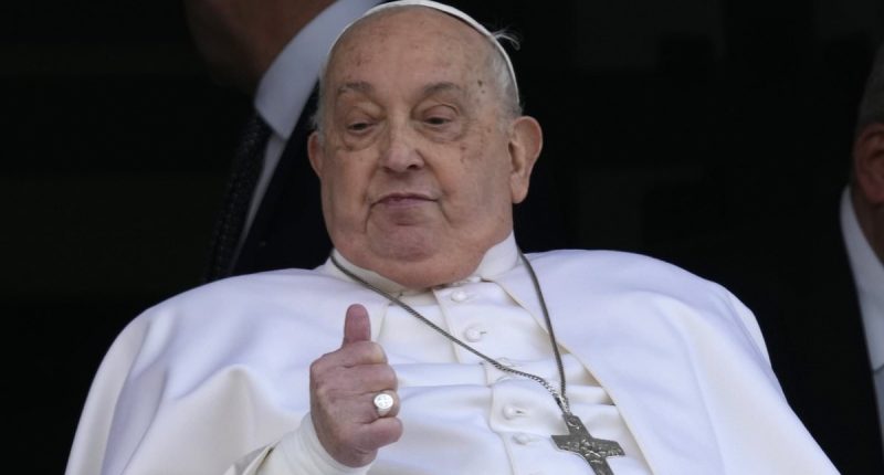 Pope Francis appears on his hospital balcony before he is discharged