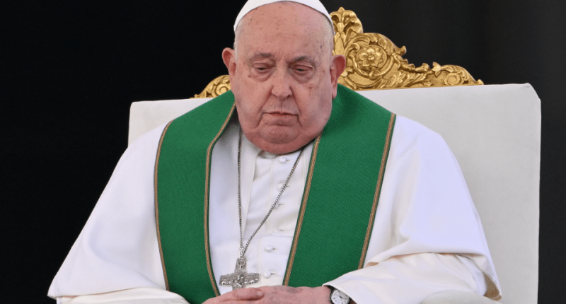 Pope Francis seated in a chair.