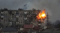 Explosion damaging an apartment building in Mariupol, Ukraine.