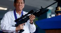 Philippine President Rodrigo Duterte holding a Galil Sniper rifle.