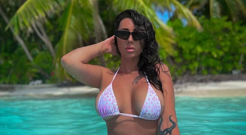 Woman in bikini in tropical water.