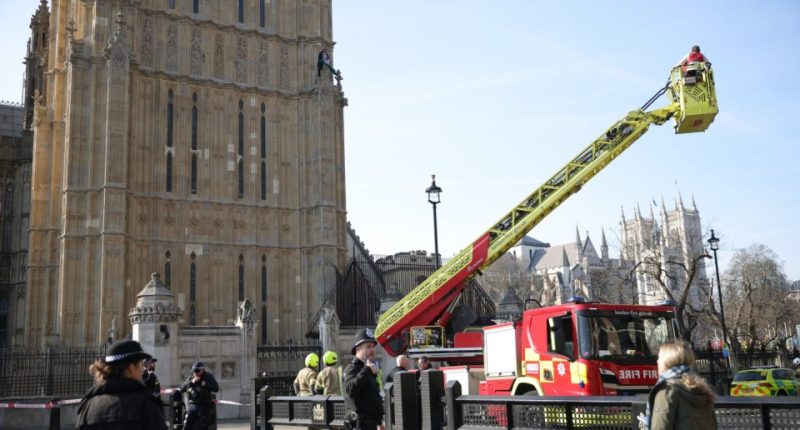©George Cracknell Wright 08/03/2025 London, United Kingdom Protester with Palestinian flag climbs Elizabeth Tower A barefoot man with a Palestinian flag has climbed part of Elizabeth Tower at the Houses of Parliament in Westminster, central london. Police and crews from the London Fire Brigade are at the scene. Photo Credit: George Cracknell Wright