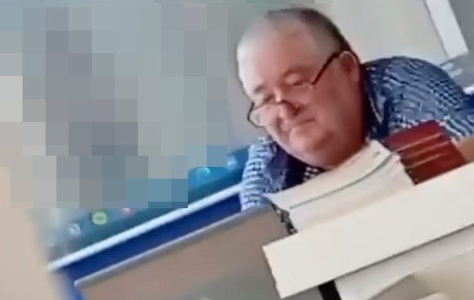 Physics teacher watching pornography on his laptop during class.