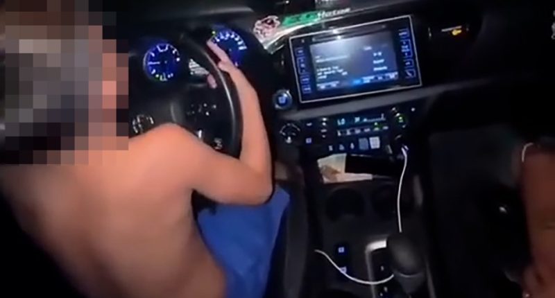 Child driving a car.