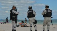 Mexican National Guard patrolling a beach.