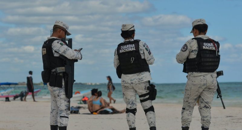 Mexican National Guard patrolling a beach.