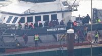 Migrants arriving in Dover on a Border Force vessel.