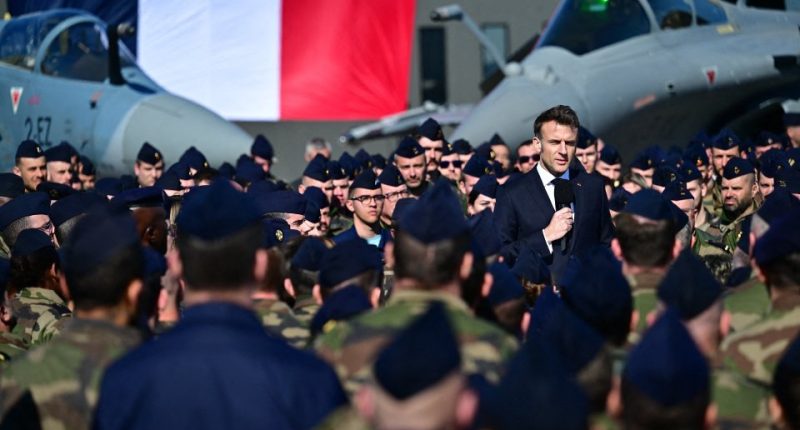 President Macron addressing French soldiers at an air base.