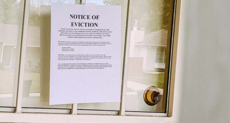 Eviction notice taped to a front door.