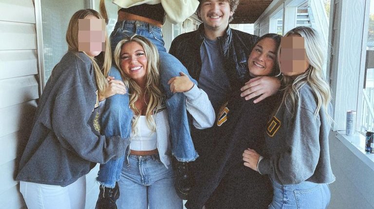 Group of college students posing for a photo.