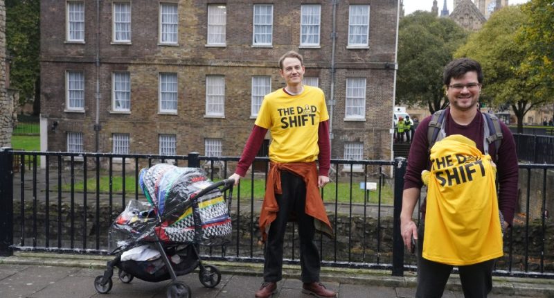 two men wearing yellow shirts that say the dad shift