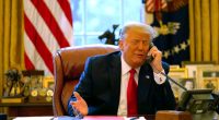 President Trump on the phone in the Oval Office.