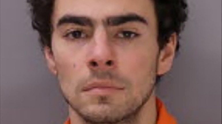 Mugshot of Luigi Mangione, a suspect in a murder.