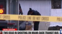Crime scene investigators at the site of a shooting on a Miami-Dade Transit bus where two passengers died.