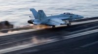 Aircraft launching from aircraft carrier.